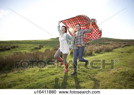 Stock Image - Women in countryside. Fotosearch