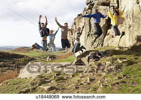 Young adults on country walk View Large Photo Image Stock Photo - Young adults on country walk. Fotosearch
