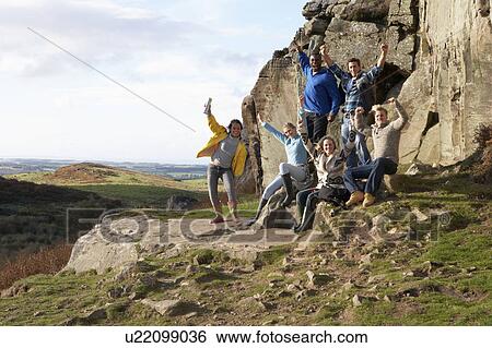 Stock Photograph - Young adults on country walk. Fotosearch