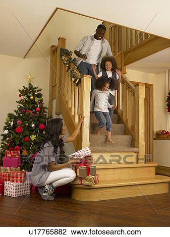 Young African American family on Christmas morning View Large Photo Image Stock Image - Young African American family on Christmas morning. Fotosearch