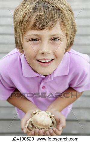 Young boy holding crab View Large Photo Image Stock Image - Young boy holding crab. Fotosearch