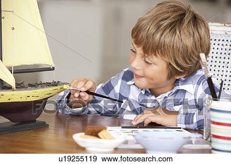 Young boy making model ship View Large Photo Image Stock Photo - Young boy making model ship. Fotosearch