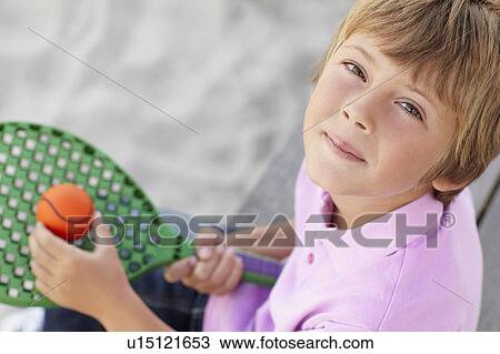 Young boy outdoors with bat and ball View Large Photo Image Stock Image - Young boy outdoors with bat and ball. Fotosearch