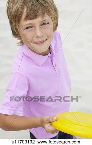 Young boy with frisbee View Large Photo Image Stock Image - Young boy with frisbee. Fotosearch
