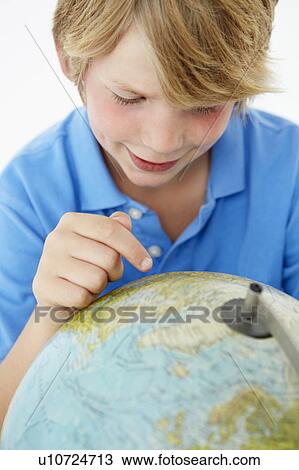Young boy with globe View Large Photo Image Stock Image - Young boy with globe. Fotosearch