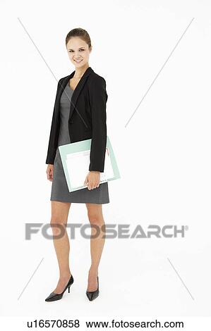 Stock Photo - Young businesswoman carrying folder. Fotosearch