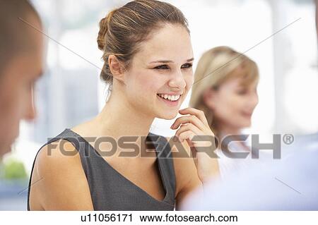 Young businesswoman in meeting View Large Photo Image Stock Image - Young businesswoman in meeting. Fotosearch