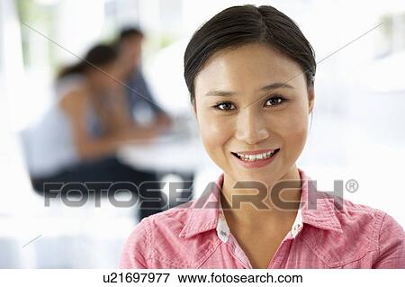 Young businesswoman in office View Large Photo Image Stock Photo - Young businesswoman in office. Fotosearch
