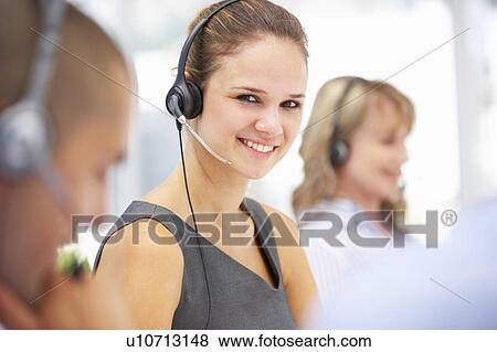 Young businesswoman wearing headset View Large Photo Image Stock Photo - Young businesswoman wearing headset. Fotosearch