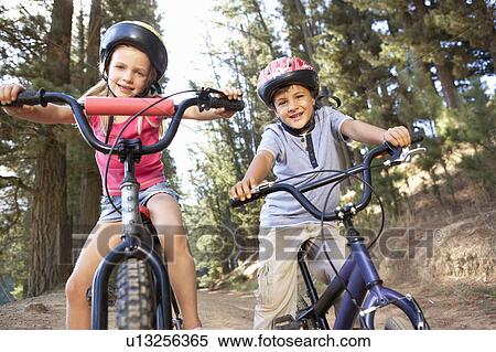 Young children on bikes in country View Large Photo Image Stock Photography - Young children on bikes in country. Fotosearch