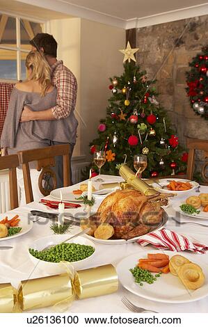 Young couple at home at Christmas View Large Photo Image Stock Image - Young couple at home at Christmas. Fotosearch