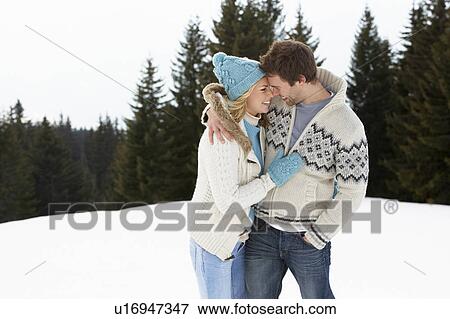 Young Couple In Alpine Snow Scene View Large Photo Image Stock Photo - Young Couple In Alpine Snow Scene. Fotosearch