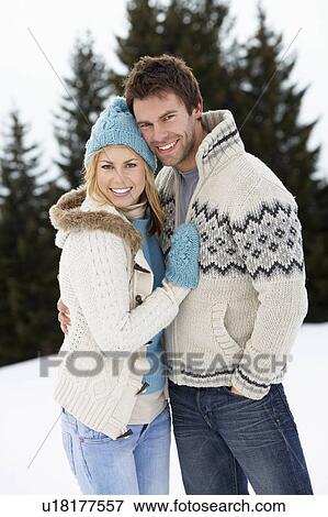 Young Couple In Alpine Snow Scene View Large Photo Image Stock Photo - Young Couple In Alpine Snow Scene. Fotosearch
