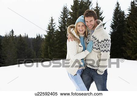 Young Couple In Alpine Snow Scene View Large Photo Image Stock Photography - Young Couple In Alpine Snow Scene. Fotosearch