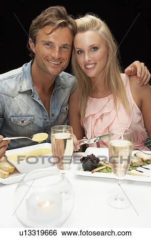 Young couple in restaurant View Large Photo Image Stock Photograph - Young couple in restaurant. Fotosearch