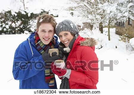 Picture - Young couple in snow. Fotosearch