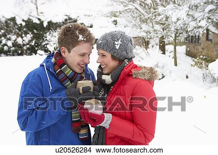 Young couple in snow View Large Photo Image Picture - Young couple in snow. Fotosearch