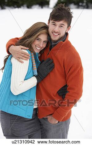 Young couple in snow View Large Photo Image Stock Image - Young couple in snow. Fotosearch
