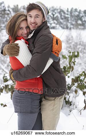 Young couple in snow View Large Photo Image Stock Photo - Young couple in snow. Fotosearch