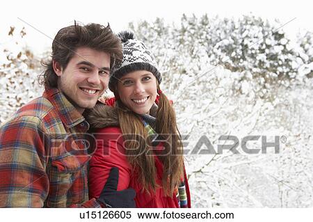Stock Photography - Young couple in snow. Fotosearch