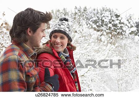 Young couple in snow View Large Photo Image Stock Photography - Young couple in snow. Fotosearch