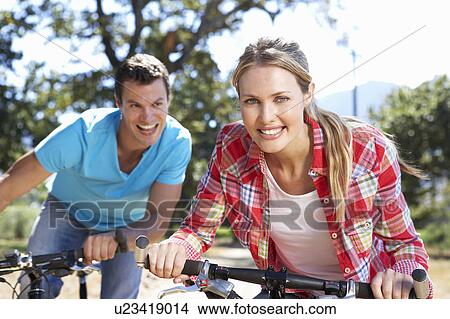 Young couple on country bike ride View Large Photo Image Picture - Young couple on country bike ride. Fotosearch