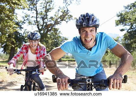 Young couple on country bike ride View Large Photo Image Stock Photography - Young couple on country bike ride. Fotosearch