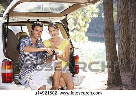 Young couple on country picnic View Large Photo Image Stock Image - Young couple on country picnic. Fotosearch