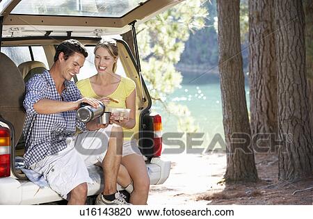 Stock Image - Young couple on country picnic. Fotosearch