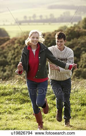 Young couple on country walk View Large Photo Image Picture - Young couple on country walk. Fotosearch