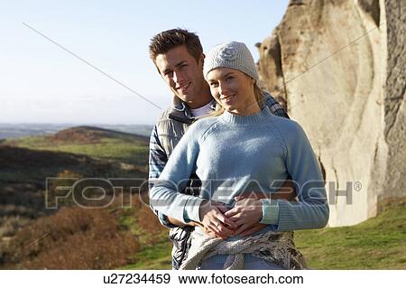 Young couple on country walk View Large Photo Image Stock Photo - Young couple on country walk. Fotosearch