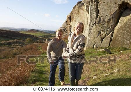 Stock Photography - Young couple on country walk. Fotosearch