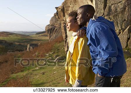 Stock Photography - Young couple on country walk. Fotosearch
