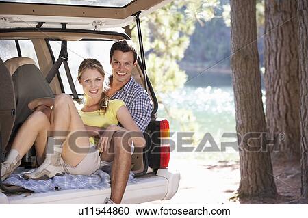 Young couple on day out in country View Large Photo Image Stock Image - Young couple on day out in country. Fotosearch