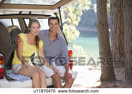 Young couple on day out in country View Large Photo Image Stock Image - Young couple on day out in country. Fotosearch