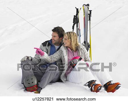 Stock Image - Young Couple On Ski Vacation. Fotosearch