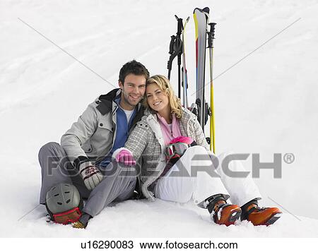 Stock Image - Young Couple On Ski Vacation. Fotosearch