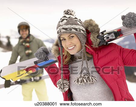 Stock Image - Young Couple On Ski Vacation. Fotosearch