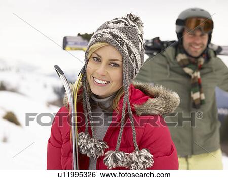 Stock Photograph - Young Couple On Ski Vacation. Fotosearch
