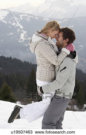 Stock Image - Young Couple On Winter Vacation. Fotosearch