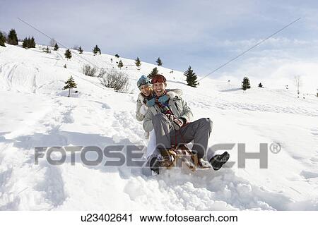 Young Couple Sledding View Large Photo Image Stock Image - Young Couple Sledding. Fotosearch