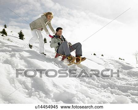 Young Couple Sledding View Large Photo Image Stock Photography - Young Couple Sledding. Fotosearch