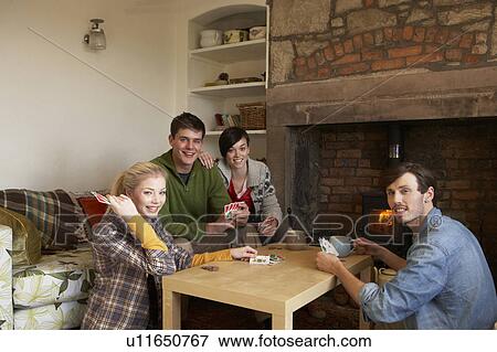 Young couples in cosy cottage View Large Photo Image Stock Photo - Young couples in cosy cottage. Fotosearch