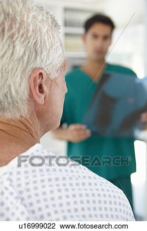 Young doctor with senior patient View Large Photo Image Stock Image - Young doctor with senior patient. Fotosearch