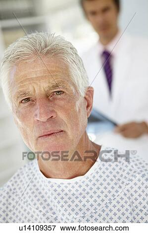 Stock Photo - Young doctor with senior patient. Fotosearch