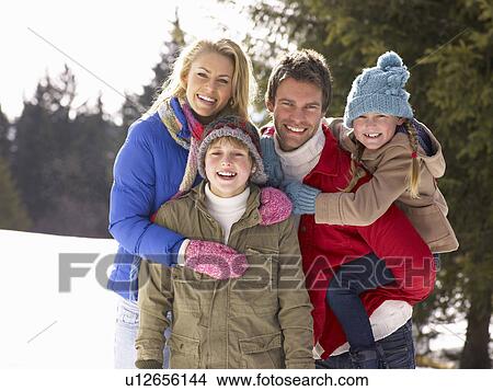 Young Family In Alpine Snow Scene View Large Photo Image Picture - Young Family In Alpine Snow Scene. Fotosearch