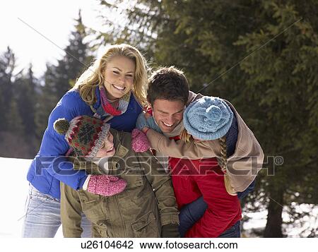 Young Family In Alpine Snow Scene View Large Photo Image Stock Image - Young Family In Alpine Snow Scene. Fotosearch