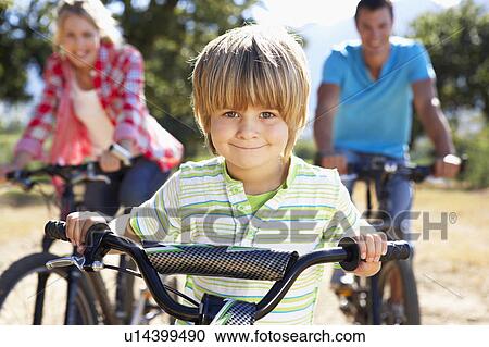 Young family on country bike ride View Large Photo Image Stock Image - Young family on country bike ride. Fotosearch