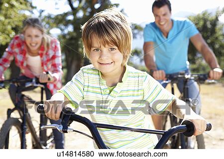 Young family on country bike ride View Large Photo Image Stock Image - Young family on country bike ride. Fotosearch