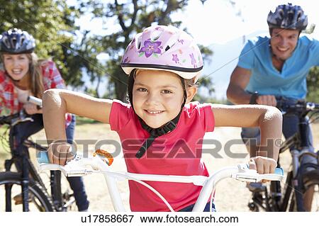 Young family on country bike ride View Large Photo Image Stock Photo - Young family on country bike ride. Fotosearch